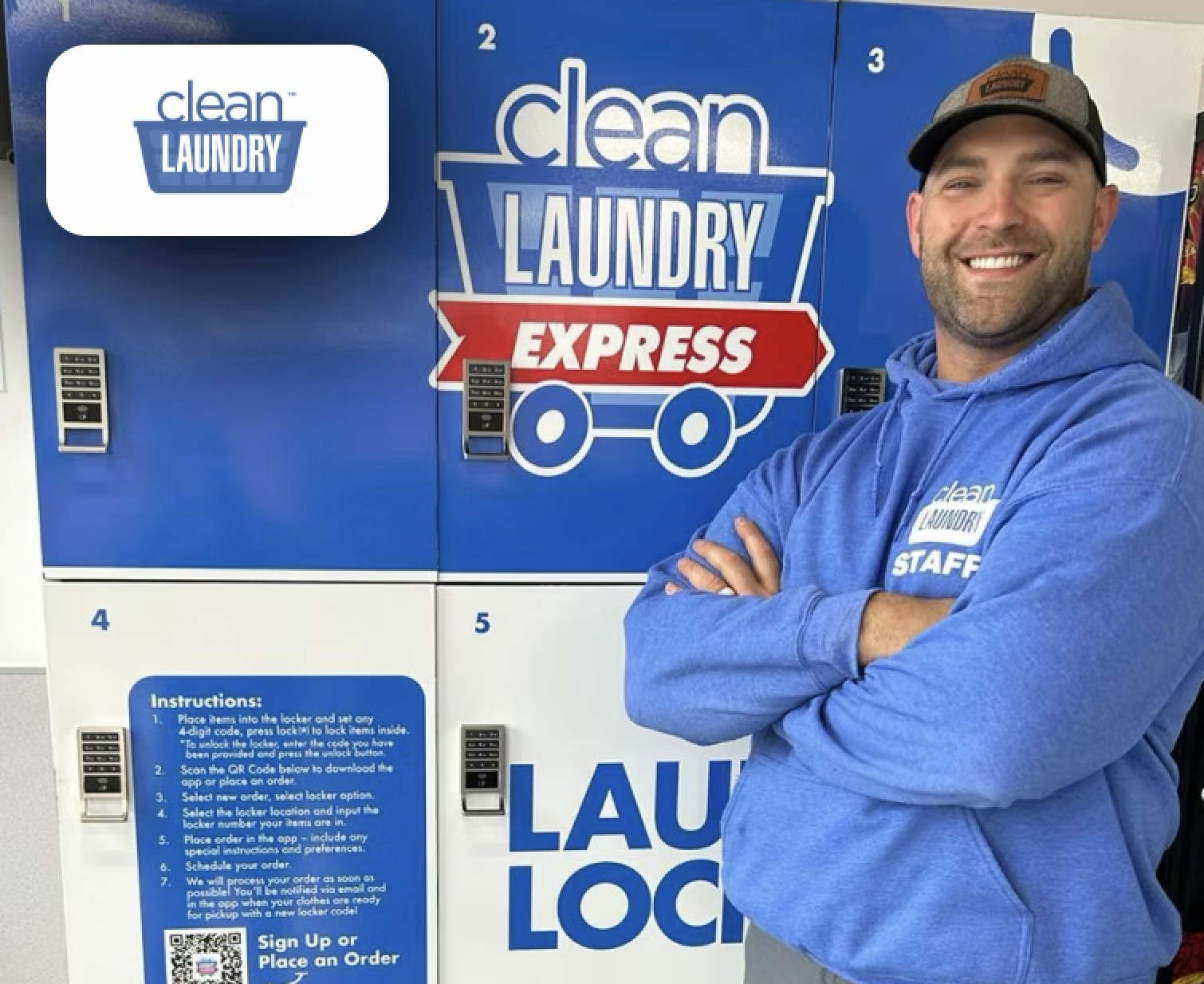 Clean Laundry Express operator standing next to bank of branded blue Clean Laundry Express smart laundry lockers with custom decals